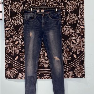 Dark distressed skinny jeans